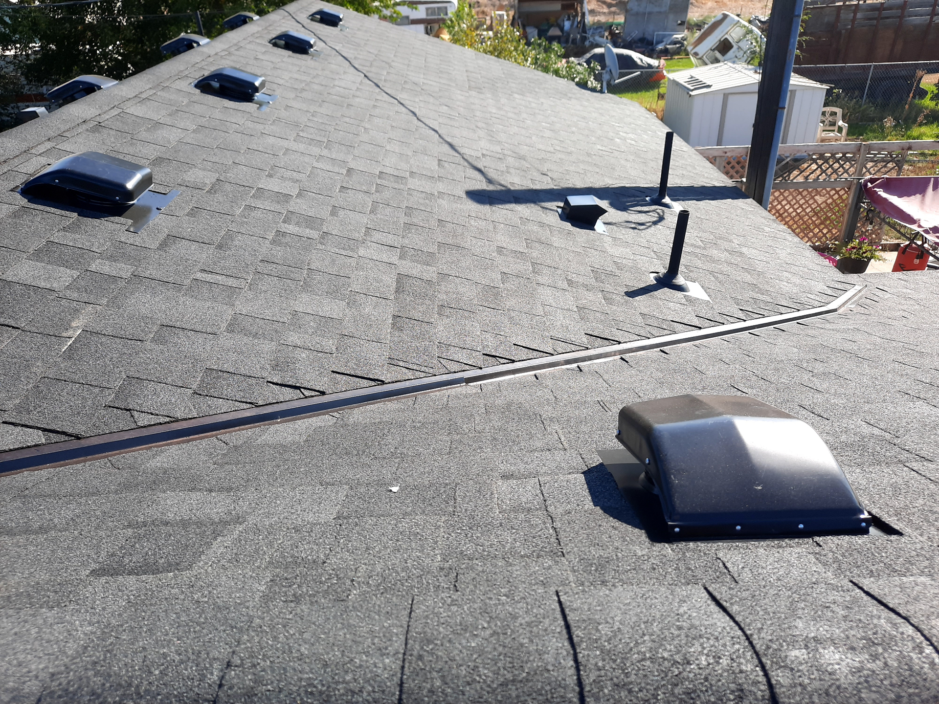 Real Santini Construction roofing project with architectural shingles and vents