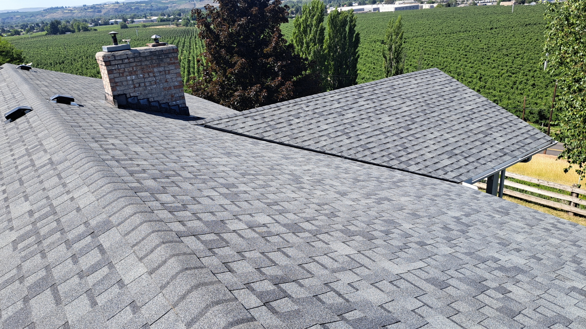 Aerial view of luxury estate home with new premium roof